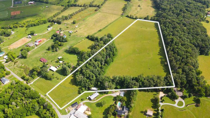 Drone shot of open acreage with the parcel boundary marked