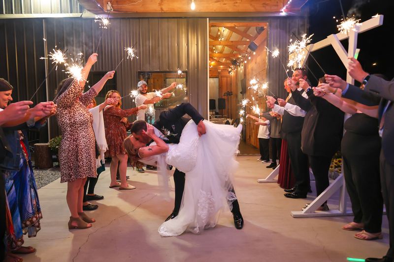 Newlyweds leaving through a sparkler send-off